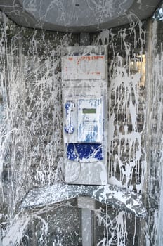 Public Telephone Cabin Vandalized with White Paint