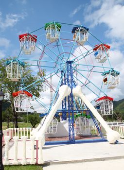 a colourful ferris wheel in the park