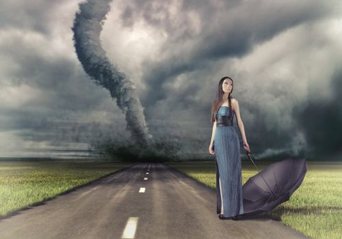 woman,with umbrella on the road and tornado (photo and hand-drawing elements compilation) 