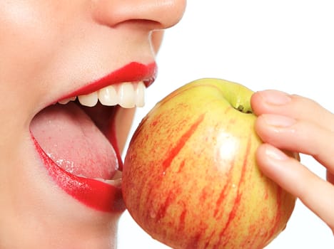 Woman biting apple up close