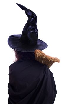 girl in Halloween witch with broom isolated