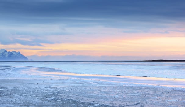 Iceland sunset and Ice shapes in the east fjords iceland at sunset in winter