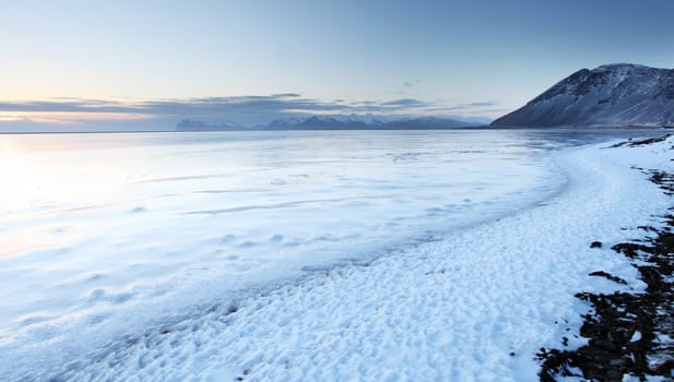 Iceland sunset and Ice shapes in the east fjords iceland at sunset in winter