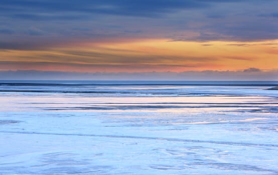 Iceland sunset and Ice shapes in the east fjords iceland at sunset in winter