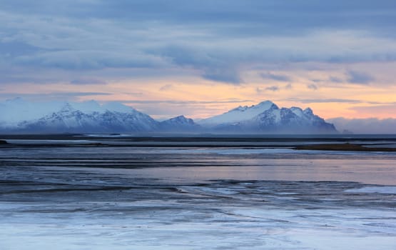 Iceland sunset and Ice shapes in the east fjords iceland at sunset in winter