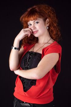 beautiful red hair woman in red dress on black