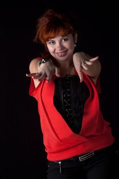 beautiful red hair woman in red dress on black