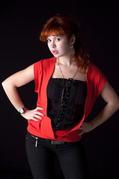 beautiful red hair woman in red dress on black