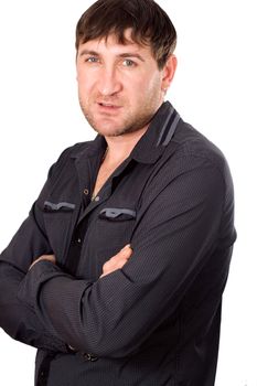 An attractive young business man posing against white background
