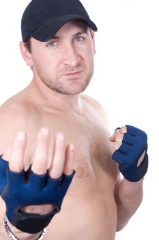 Naked man in gloves in a pose of a boxer
