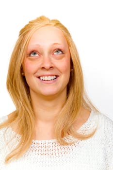 An attractive girl is photographed in the studio with a white background for this portrait.