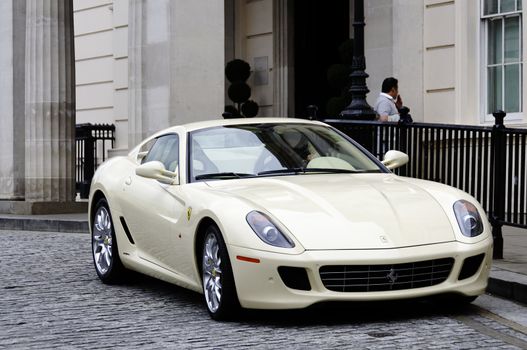 A Ferrari 599 GTB Fiorano in front of the Lanesborough hotel in London
