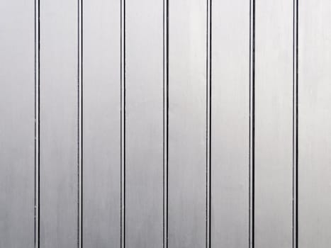 A silver painted wooden wall