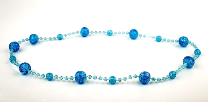 Women's jewelry, blue beads, isolated on a white background