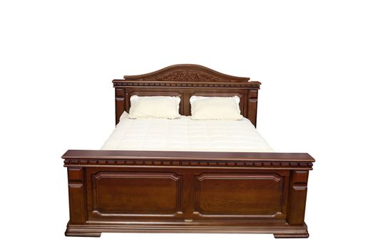 Vintage wooden bed isolated on white