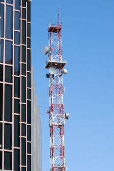 Tall communication tower with satellite dishes