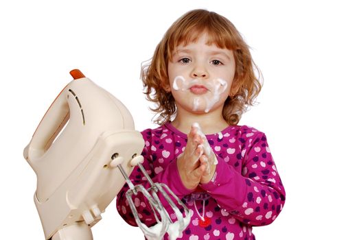 Little girl with cream and mixer