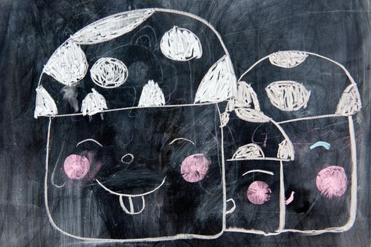 child's chalk drawing on the chalkboard