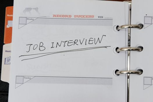 Job interview words written on notebook