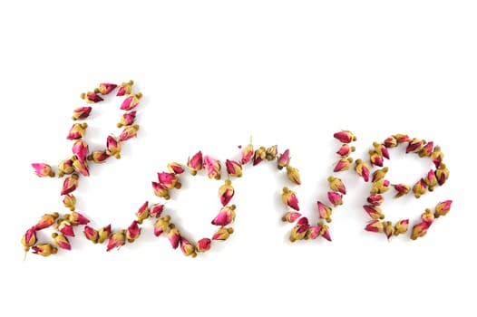 Love word made of dried flowers on white background