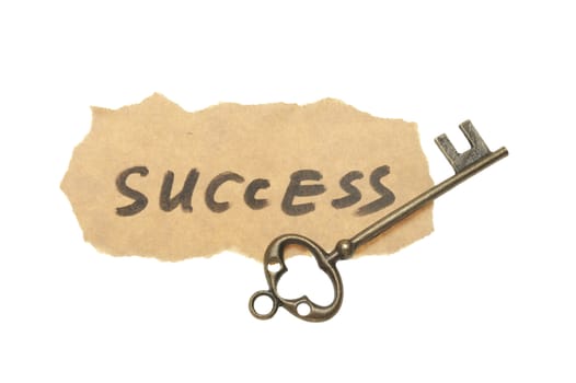 Old key and success words written on old paper
