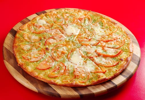 Pizza with tomato and cheese . italian kitchen. Studio