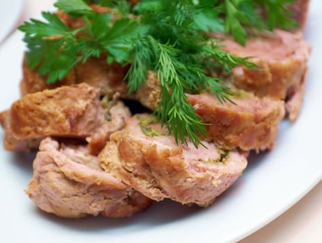 Toasted fried meat roll and it's slices on plate 