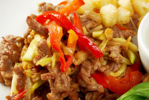 Italian cuisine.healthy salad  with meat ,cracker and basil