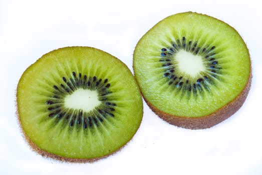 Kiwi fruit sliced segments isolated on white background