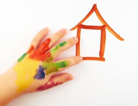 A small child's hand soiled in paints draw  a lodge