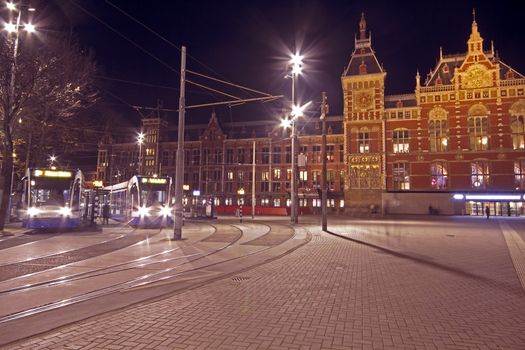 City scenic from Amsterdam in the Netherlands with the central station at night