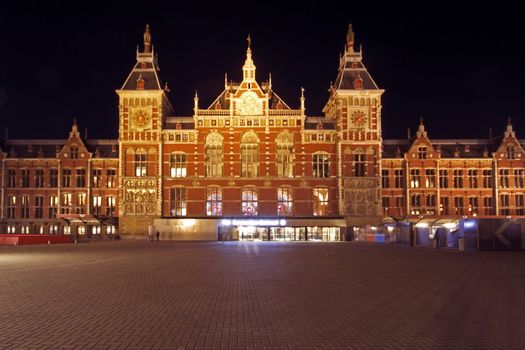 City scenic from Amsterdam in the Netherlands with the central station at night