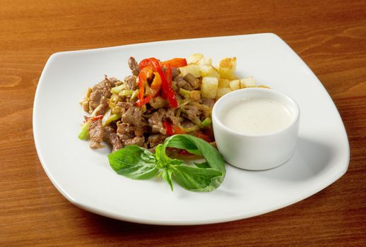 Italian cuisine.healthy salad  with meat ,cracker and basil