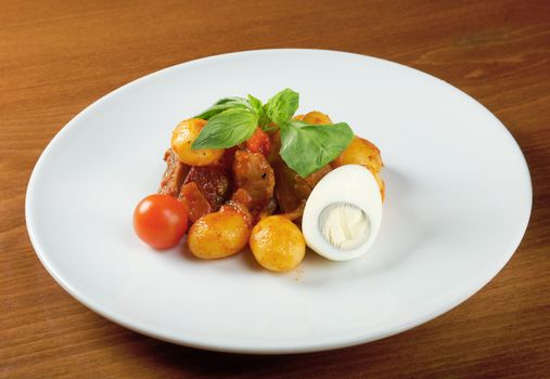 roast of veal with potatoes.closeup