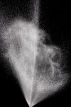 Highspeed Photography of Explosion of Water Filled Spray on black background