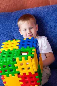 small boy playing with cubes