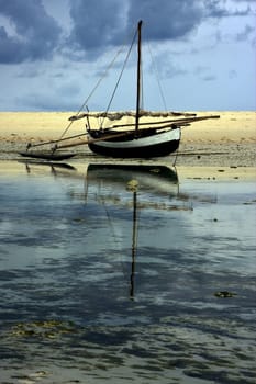 A boat and his reflex in the madagascar sea