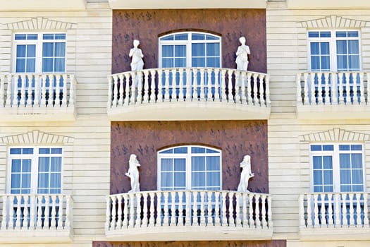 female sculptures on the facade of the building