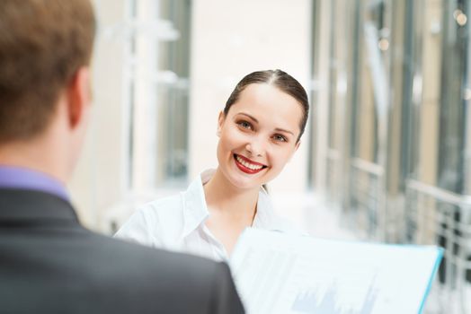 business woman with a colleague discussing documents in the office