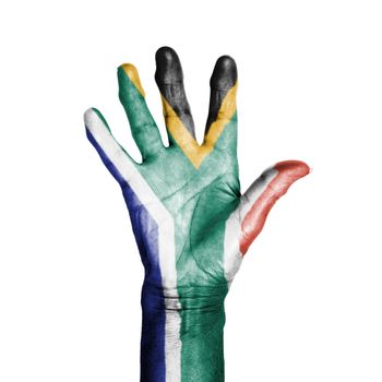 Hand of an old woman, wrapped with a pattern of the flag of South Africa, isolated on white