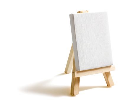 Empty blank canvas on wooden easel isolated on white background