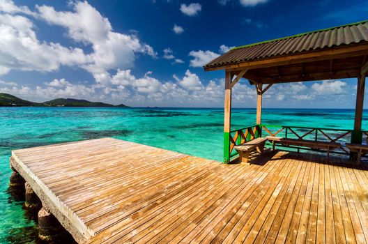 Wooden dock in beautiful blue and turquoise water in San Andres y Providencia, Colombia