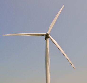 Wind turbine in blue sky