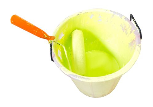 Paint-roller and Paint bucket with paint on a white background