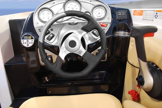Yacht dashboard with steering wheel and gearshift
