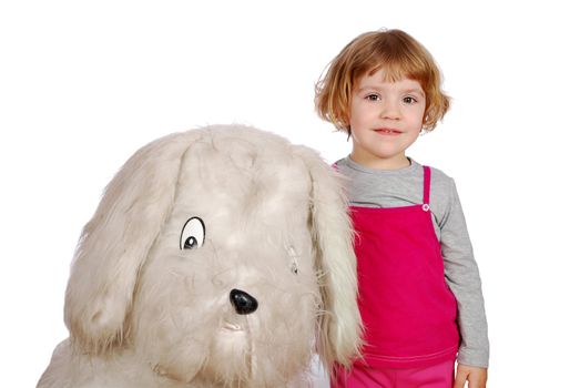 Little girl with big puppy toy studio shot