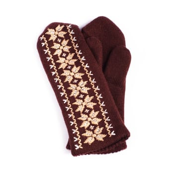 Brown woolen knitted mittens on white background