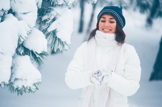 Portrait of beautiful young girl in winter day