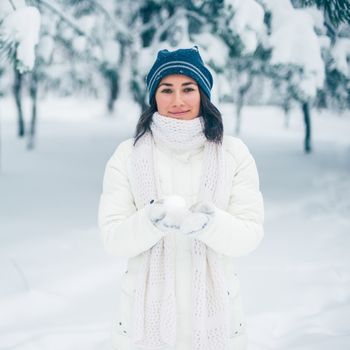 Portrait of beautiful young girl in winter day