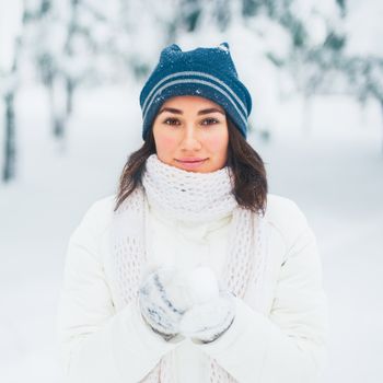 Portrait of beautiful young girl in winter day